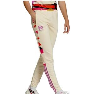 ADIDAS TIRO X THEBE MAGUGU SIDE STRIPED
TRACK PANTS  E